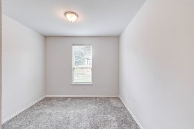 Carpeted spare room with baseboards | Image 16