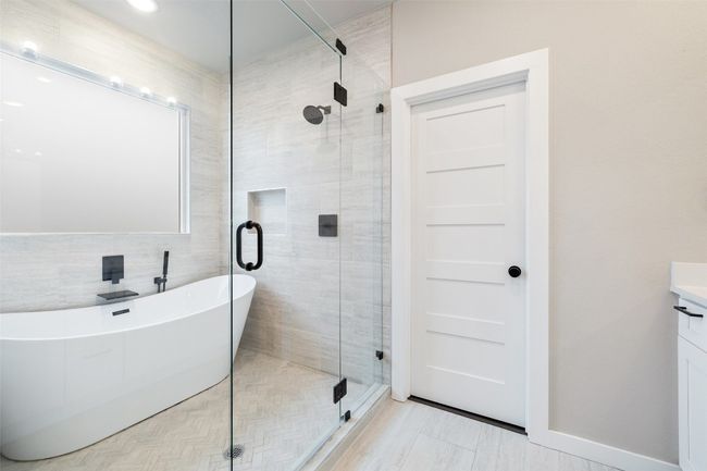 wet area featuring soaker tub and shower | Image 35