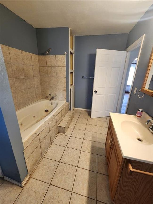Bathroom with tile patterned flooring and vanity | Image 19