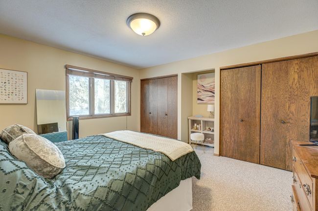 Relax in your large primary bedroom, complete with a private bath—your personal retreat for comfort and tranquility | Image 17