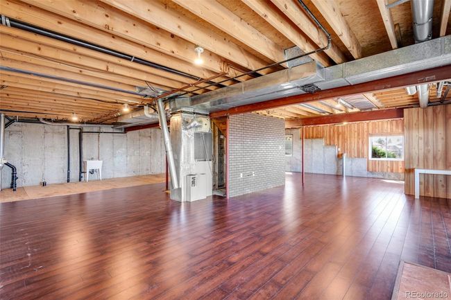 Basement with hardwood / wood-style floors and a sink | Image 36