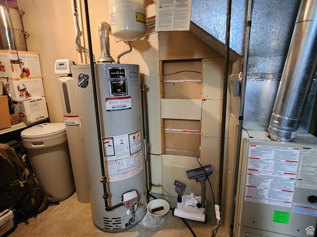 Utilities featuring gas water heater | Image 43