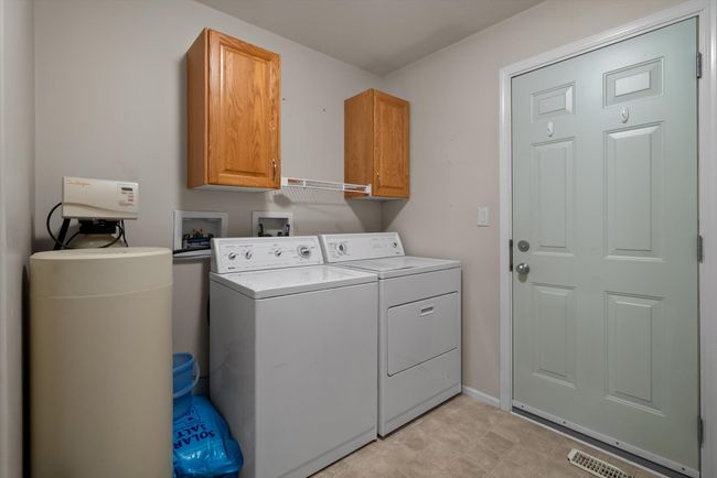 Laundry Room with water softner. | Image 17