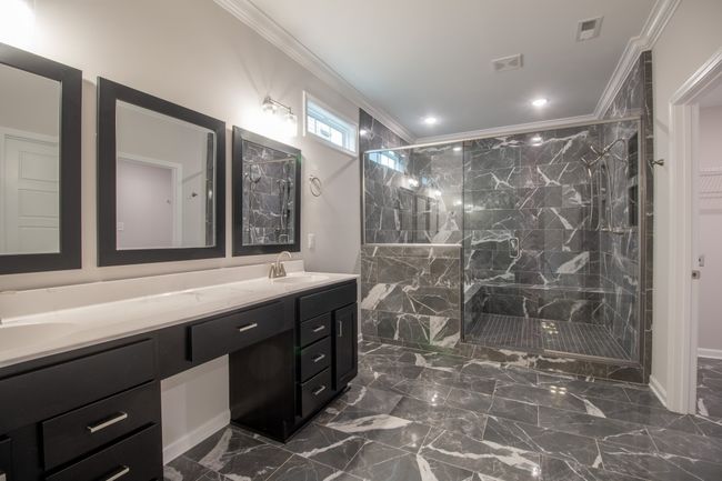 EXAMPLE>>>Primary Bathroom Features a Luxurious Shower, Double Vanity w/ Cosmetic Area, Private Toilet Room & Access to the Laundry Room! | Image 12