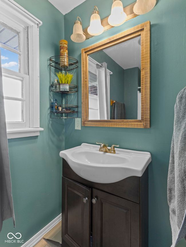 bathroom featuring baseboards and vanity | Image 21