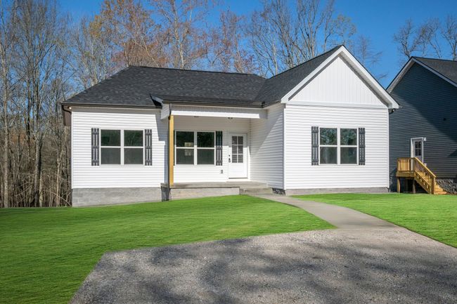 Incredible Curb Appeal + Concrete Sidewalk Note: Green Grass Edits on all Exterior Photos | Image 29