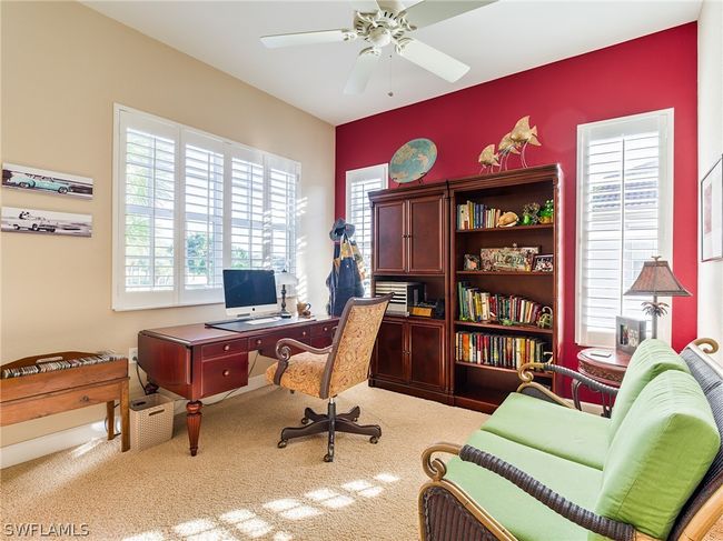 Carpeted home office with ceiling fan | Image 21