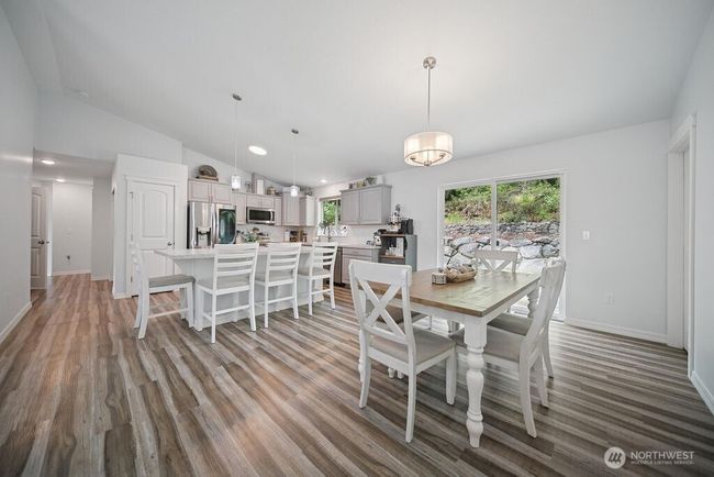 Dining eating area is open to living room and kitchen. | Image 10