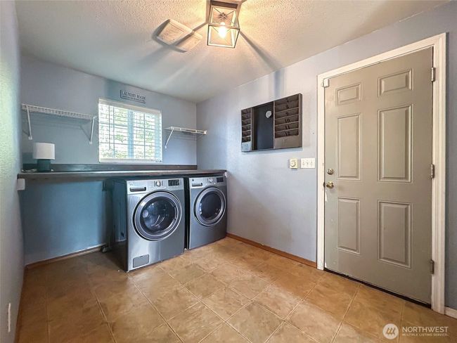 Laundry room and garage entrance | Image 11