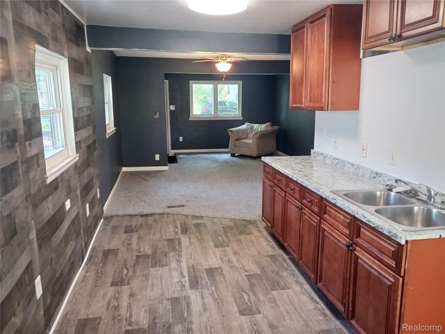 Kitchen looking in to the living room | Image 9