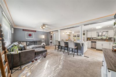 Move-in ready! Open Concept. Recessed lighting above the crown molding. Newer carpet!! | Image 3