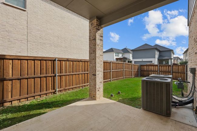 View of patio / terrace featuring central air condition unit and a residential view | Image 27