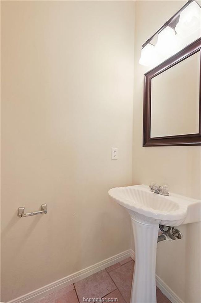 Bathroom with baseboards and tile patterned floors | Image 12