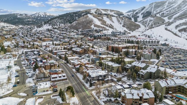 Snowy aerial view featuring a mountain view | Image 52