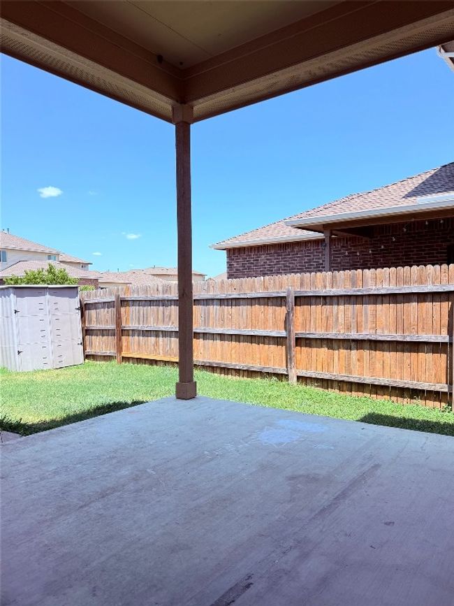 View of patio with a storage unit | Image 20