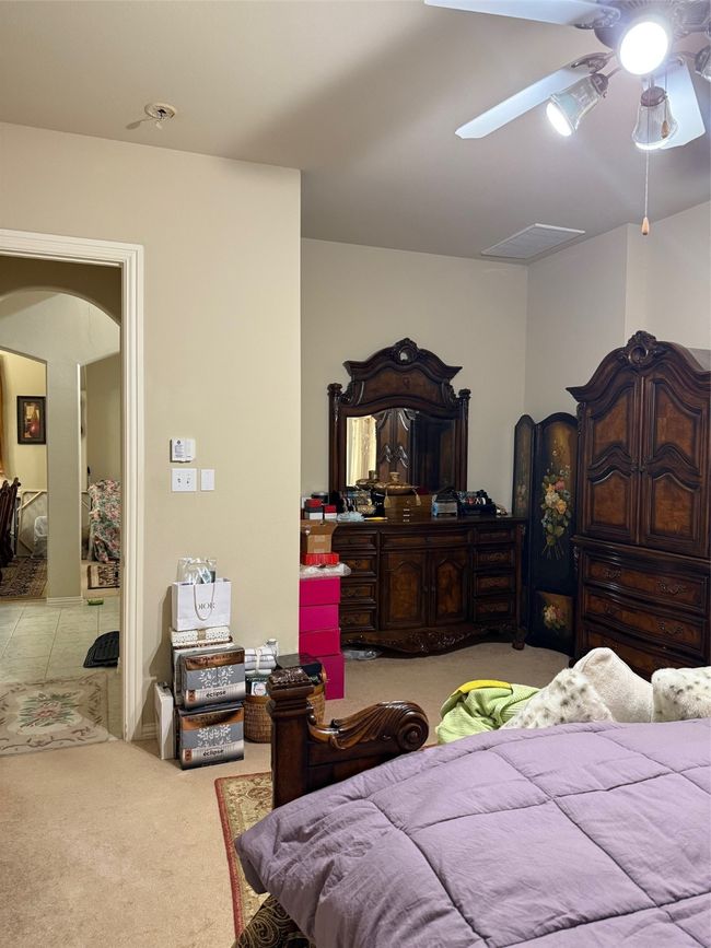 Carpeted bedroom featuring arched walkways | Image 24