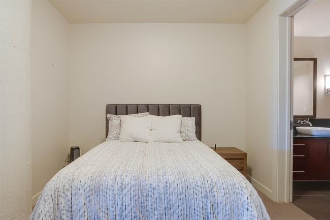 Carpeted bedroom featuring a sink | Image 24