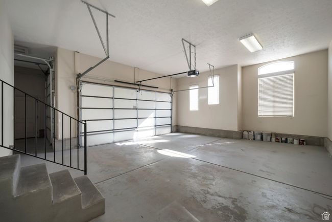 Garage with a garage door opener | Image 35