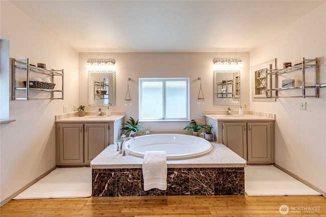 Dual vanities and large soaking tub. | Image 27