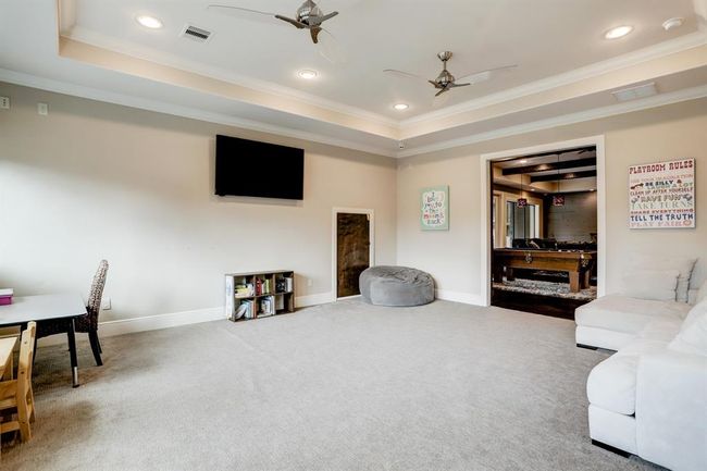 Flexible use as a TV room or study room. | Image 36