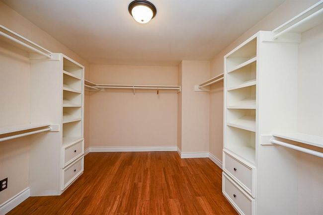 A previous bedroom was converted into a large master closet. A must see!! | Image 21