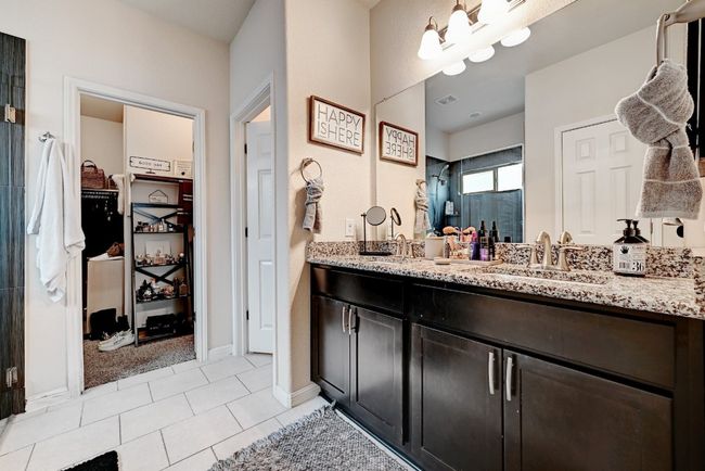Primary bathroom with double sinks and walk in closet | Image 10
