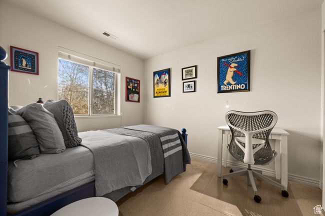 Bedroom featuring light carpet | Image 18
