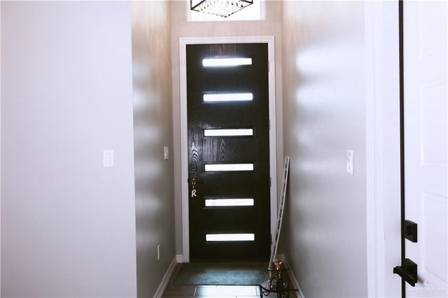 Entryway featuring baseboards and stairs | Image 7