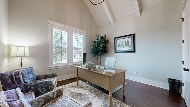 This stunning home office offers vaulted ceilings, rich hardwood floors, and plenty of natural light—creating a serene and stylish space to work, read, or unwind. | Image 26