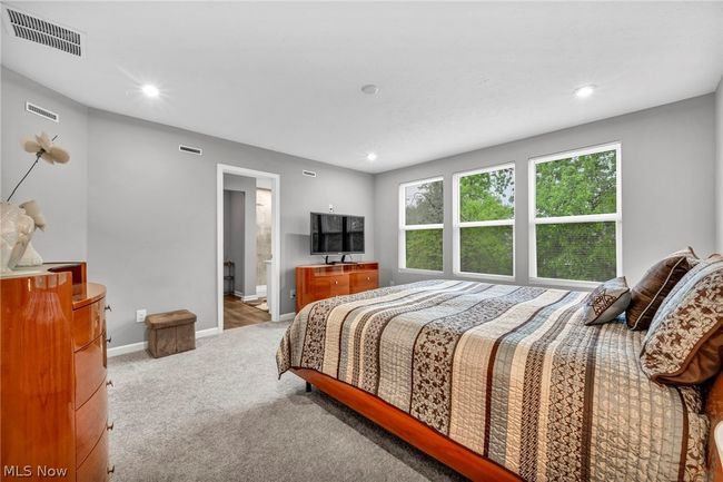 Bedroom featuring ensuite bath and carpet flooring | Image 32