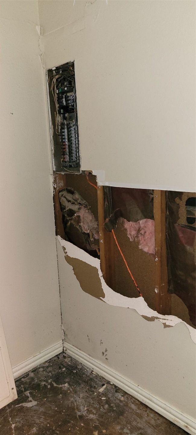 Detailed view of baseboards and unfinished concrete flooring | Image 24