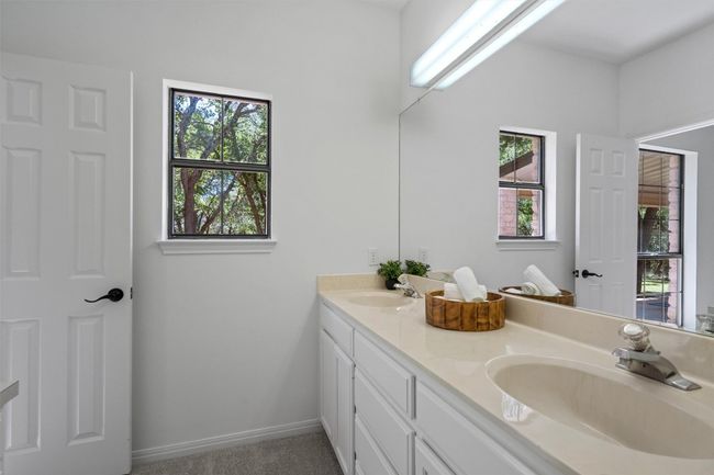 Full bath with baseboards, a sink, and double vanity | Image 18