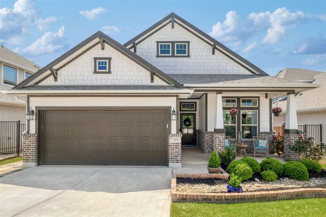 Craftsman-style home featuring a porch, a front entry attached garage | Image 11