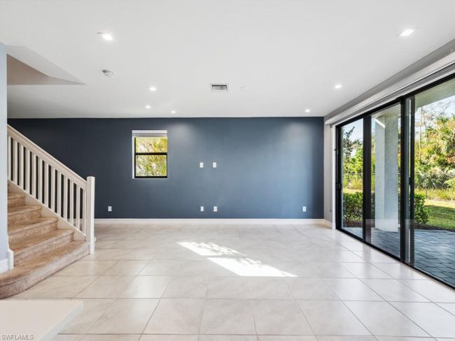Unfurnished room featuring light tile patterned floors and a wealth of natural light | Image 7