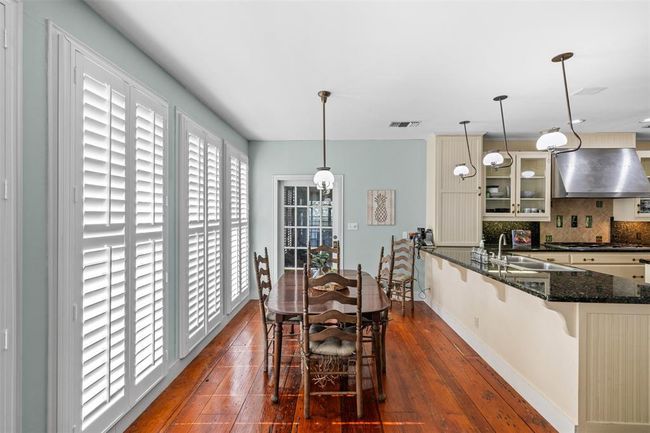 Sun drenched breakfast area with floor to ceiling shutters. | Image 13