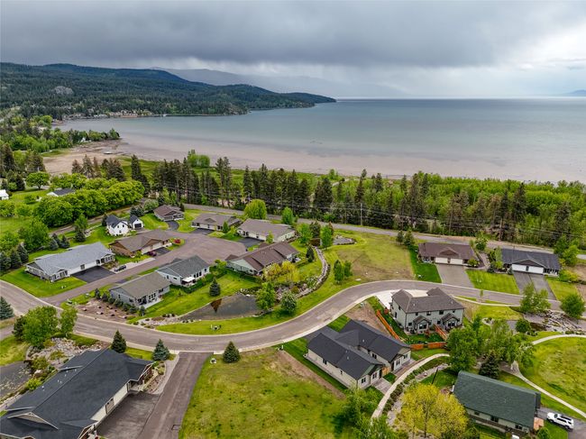 Aerial view of residential area with a large body of water | Image 29