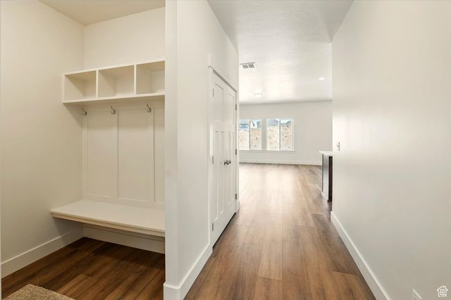 Mudroom with baseboards and wood finished floors | Image 4