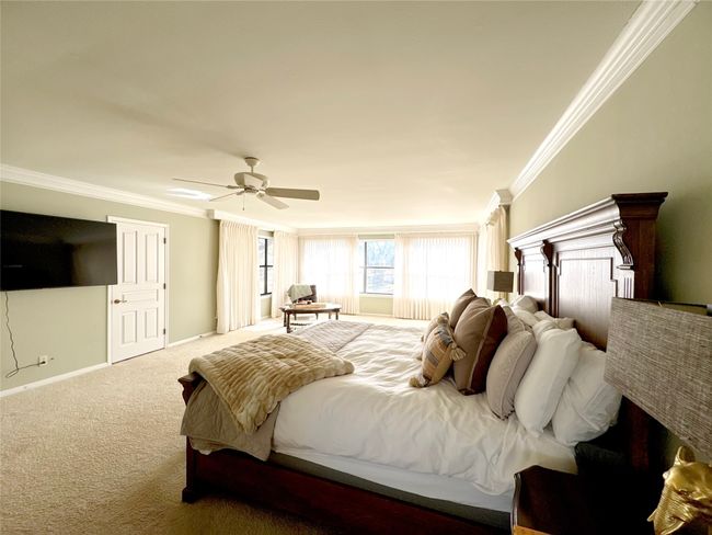 Carpeted bedroom featuring ceiling fan and ornamental molding | Image 27