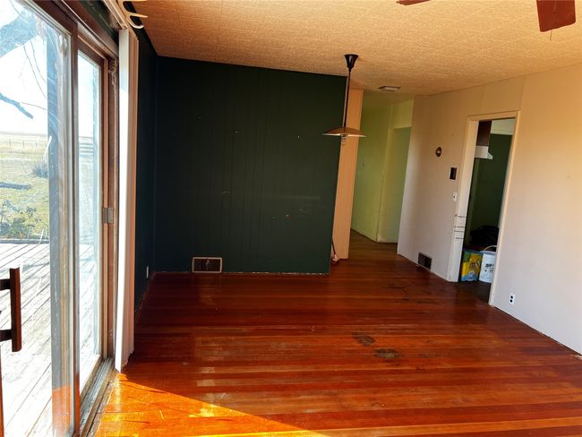 Empty room featuring visible vents and wood-type flooring | Image 59