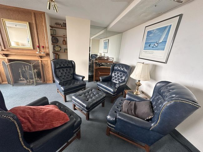 relax in the community room by the fireplace | Image 22