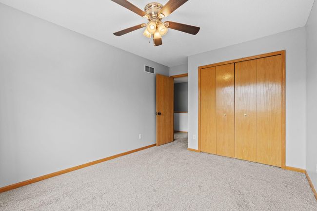 Second bedroom offers a spacious closet and comfortable layout. | Image 19