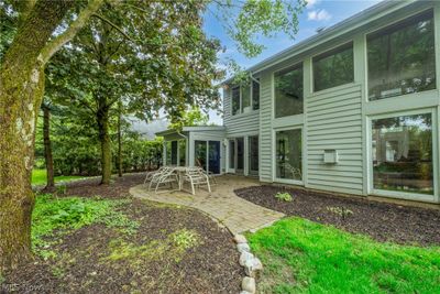 Rear view of property with a patio area and Florida room addition | Image 2