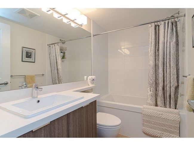 Full bath with visible vents, toilet, vanity, and shower / bathtub combination with curtain | Image 14