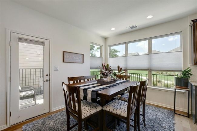 Dining space with light wood finished floors, baseboards, and recessed lighting | Image 13