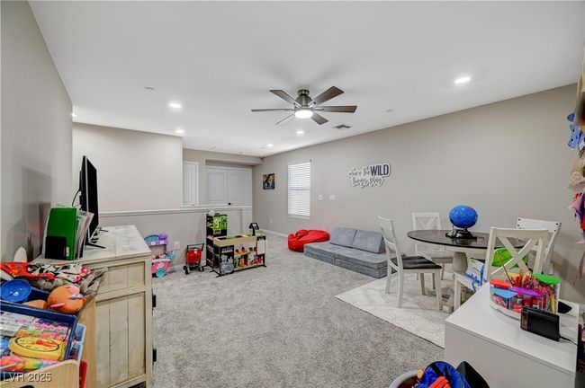 Recreation room with ceiling fan, recessed lighting, carpet, and baseboards | Image 36