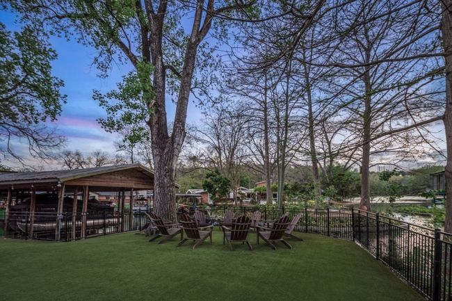 View of yard featuring fence and a fire pit | Image 39