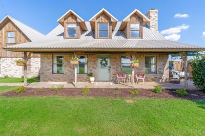 View of front of home featuring a front lawn | Image 1