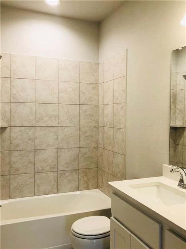 Bathroom with vanity and shower / bath combination | Image 11