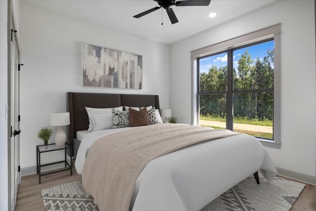 Bedroom with wood finished floors, a ceiling fan, and recessed lighting | Image 32