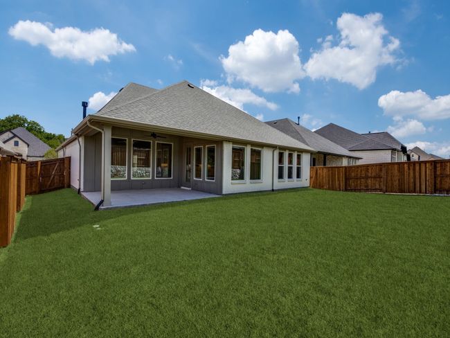 Offering a spacious covered back patio and fenced yard, the entire family will enjoy backyard BBQs in this wonderful home! | Image 16